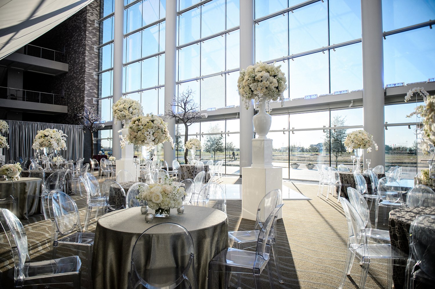 bright flowers, sparkly linens, big windows for houston wedding venue