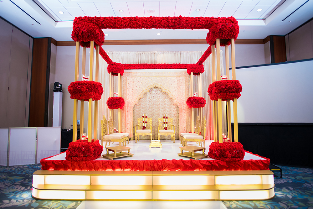 south asian, altar, gold and red, hotel ballroom, wedding venue in houston, texas 