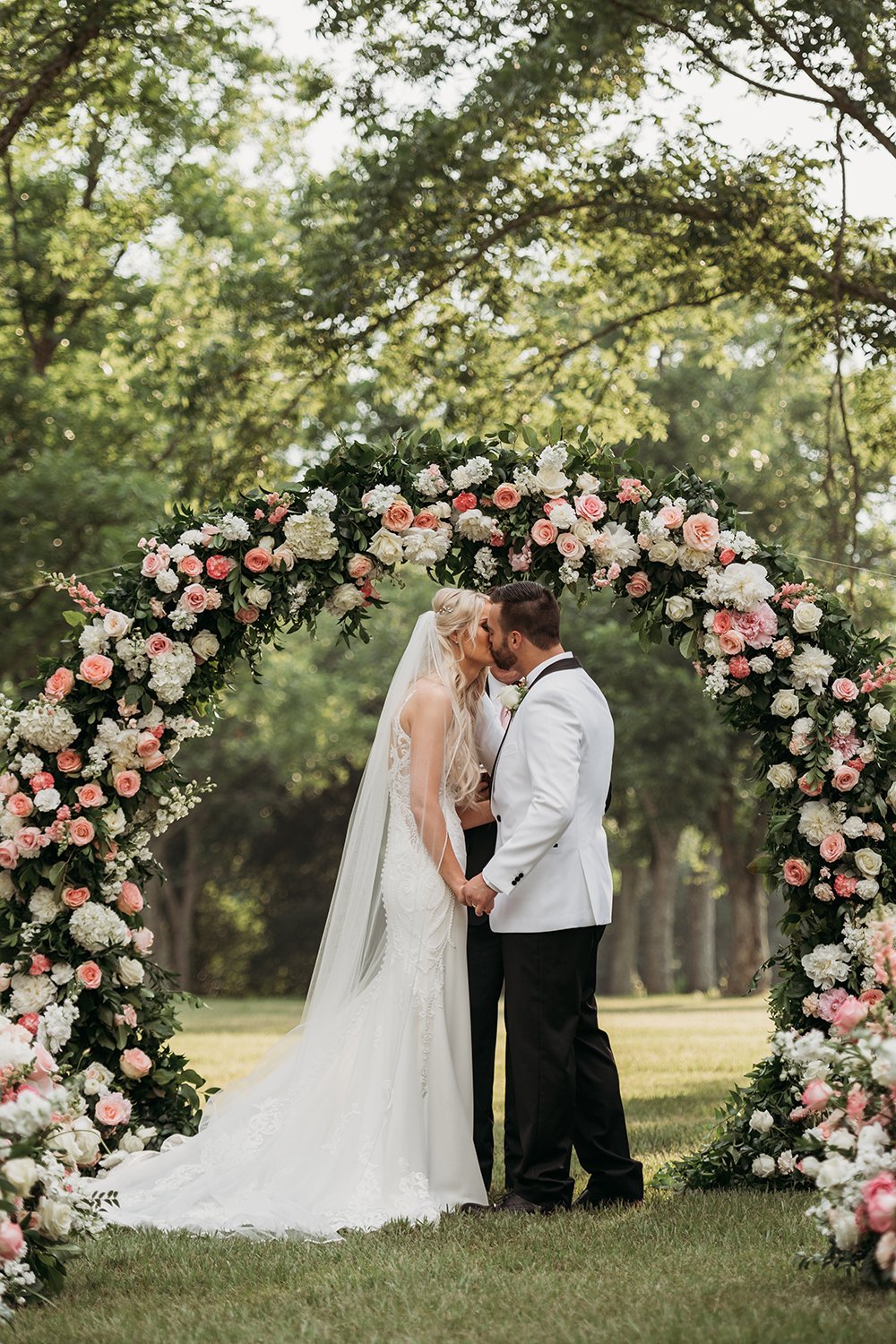 outdoor wedding ceremony - floral arch