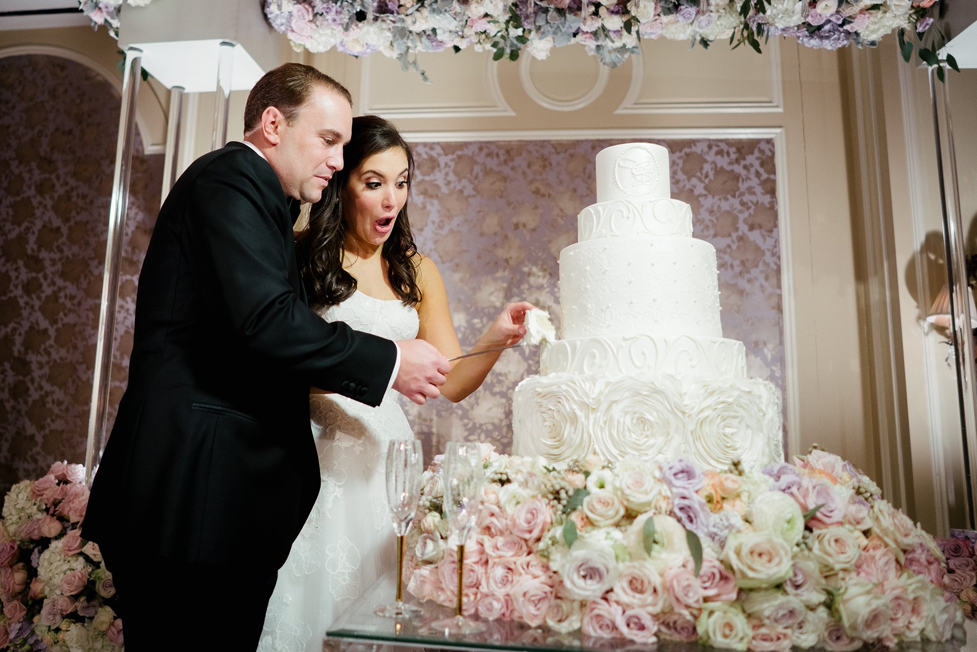 hotel wedding, wedding cake, cutting the cake, Susie's Cakes & Confections, Pink Flowers, couple
