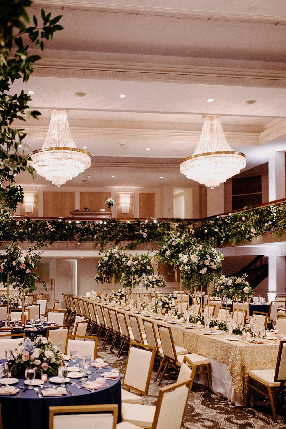 wedding reception decor - crystal chandeliers - greenery