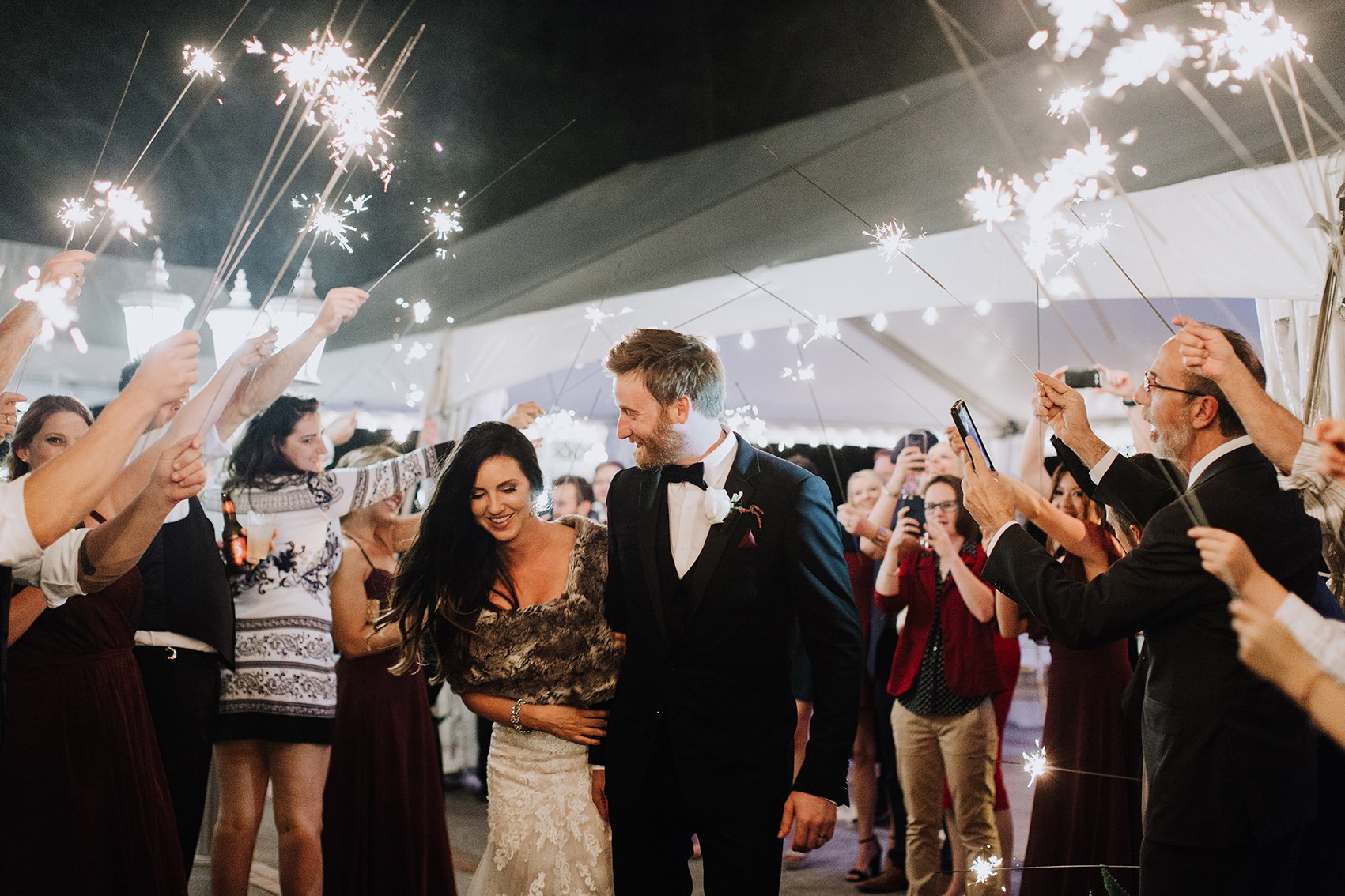 couple exit, sparklers, bride, groom, wedding photography