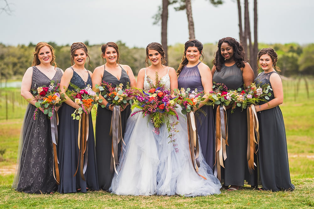 gray bridesmaids dresses  pink and orange bouquets