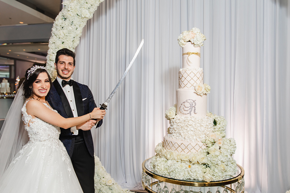 cutting the cake - wedding - sword - middle eastern