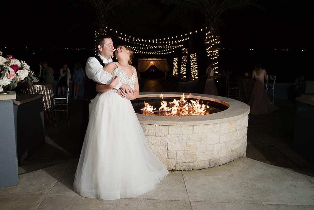 romantic first dance, patio, outdoor, reception, fireplace, string lights, nighttime photography