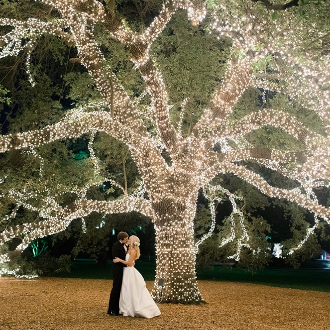 giant lit tree with newlywed couple - houstonian - wedding photography