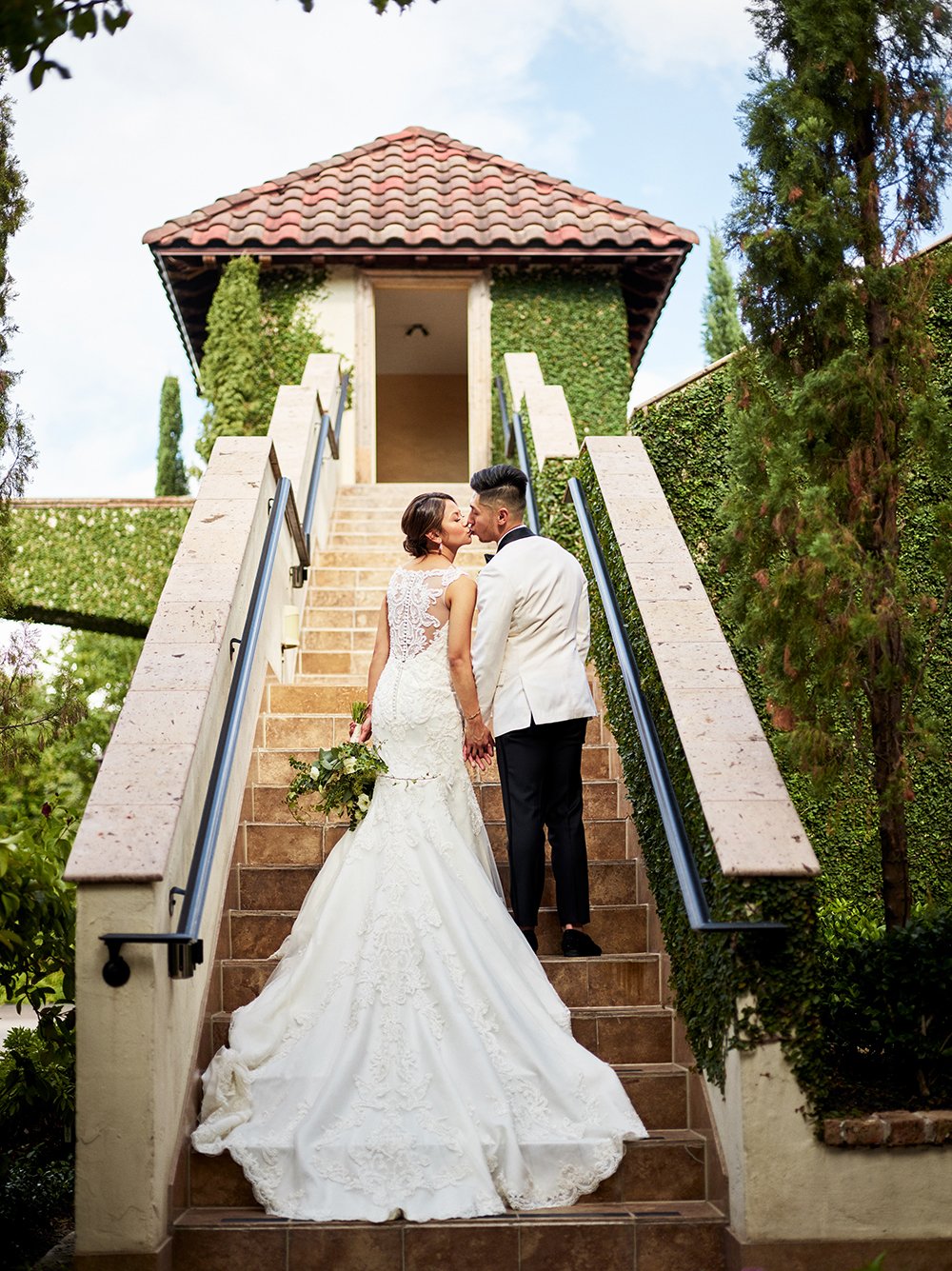 wedding gown on steps at the bell tower on 34th - houston venue