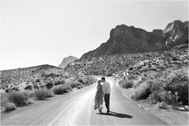Couple walking down desert road