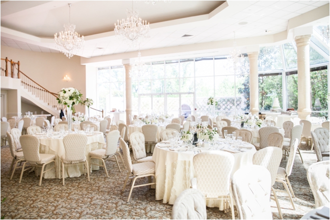 ashton gardens wedding venuee ballroom chandeliers windows white columns staircase