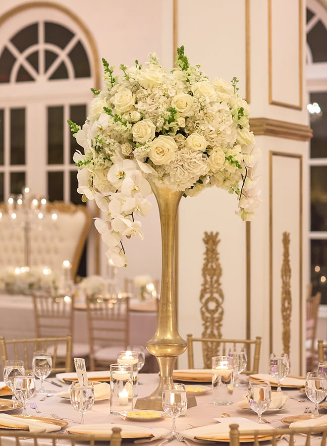 houston wedding, chateau cocomar, white and gold decor, wedding reception, floral centerpiece with white flowers, wedding reception decor, luxe chateau cocomar wedding