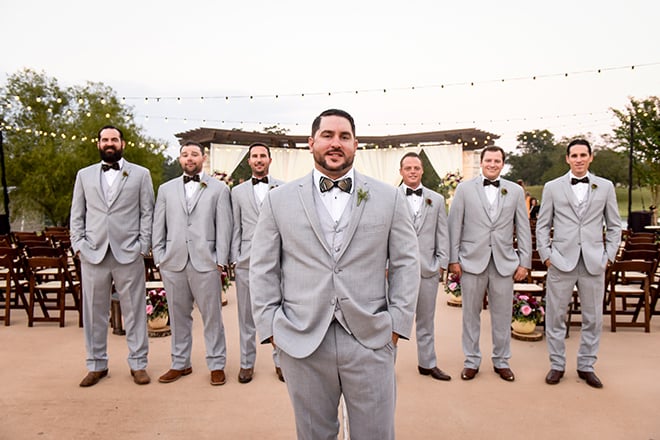 rustic autumn wedding, briscoe manor, kiss and makeup houston, outdoor wedding ceremony, string lights, groom, groomsmen, gray men's suits