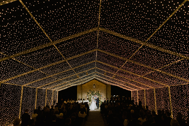 astros new year's eve wedding outdoor ceremony golden string lights