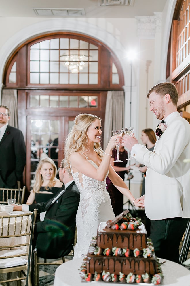 cutting the cake, cheers, champagne, bride, groom, groom's cake, chocolate, strawberries, amy maddox photography