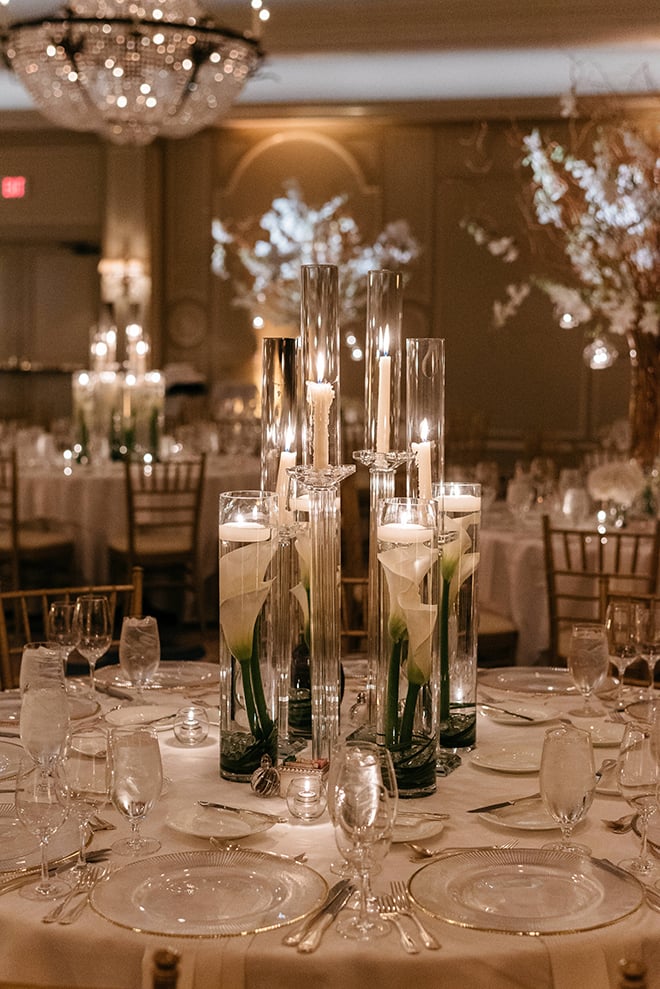 enchanted wedding, white orchids, candles, cherry blossom trees, floating candles, orbs, tall tapered candles, reception decor, white linens, the houstonian
