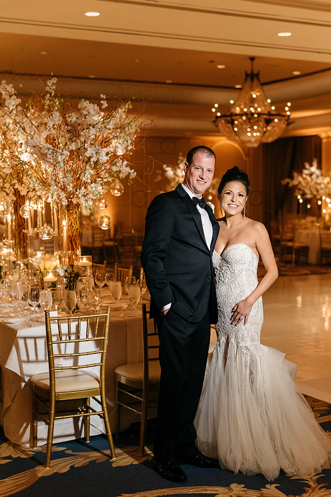 enchanted wedding, white orchids, candles, cherry blossom trees, floating candles, orbs, tall tapered candles, reception decor, white linens, the houstonian