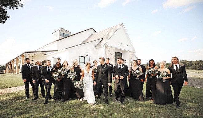 Couple , bridesmaids, and groomsmen at Deep In The Heart Farms.