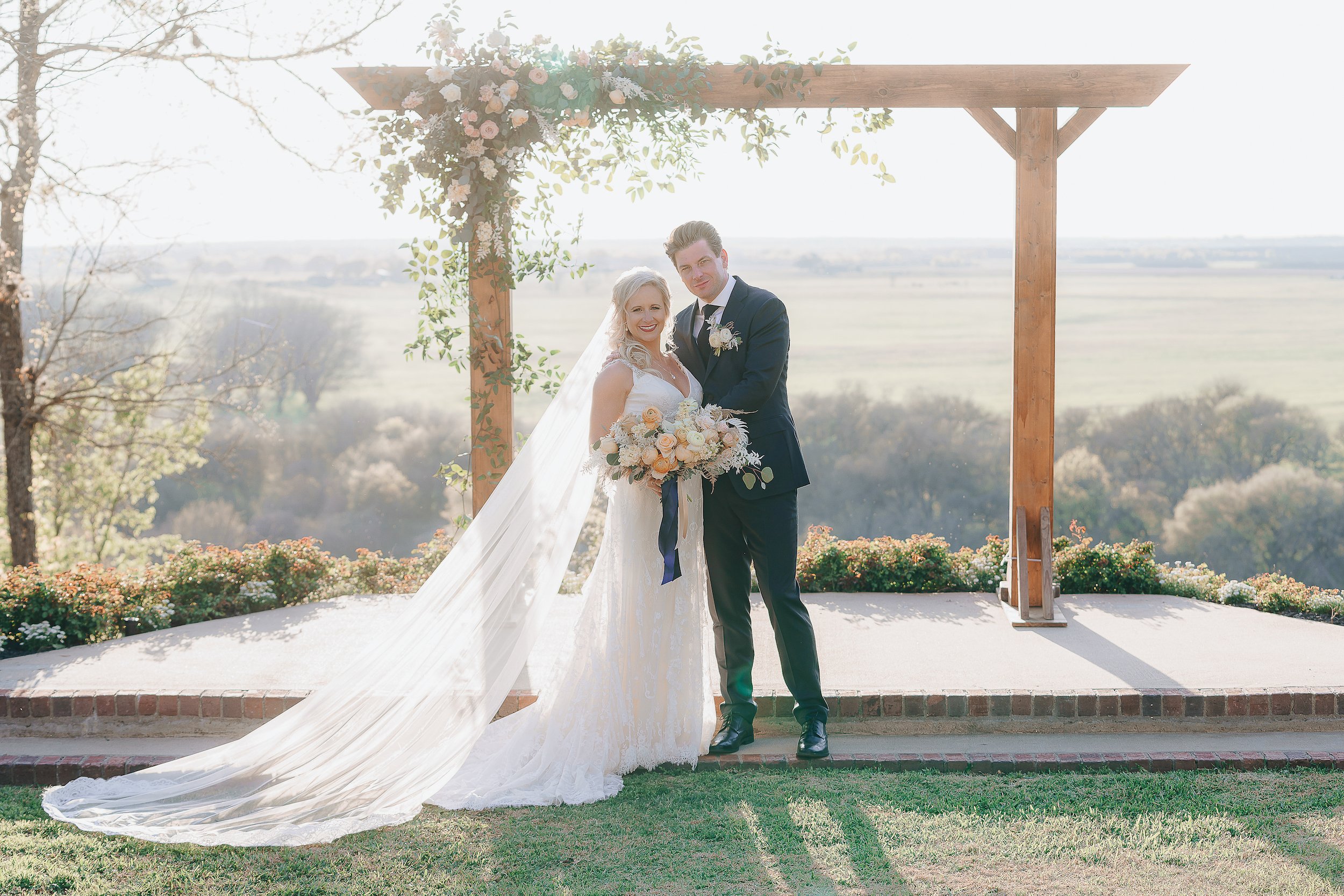 Couple posing at the altar in the Texas hill country