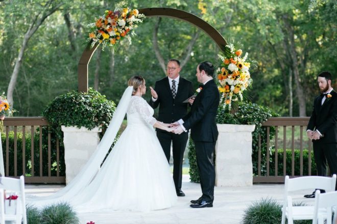 Multi-colored orange, white, and yellow flower arrangements.