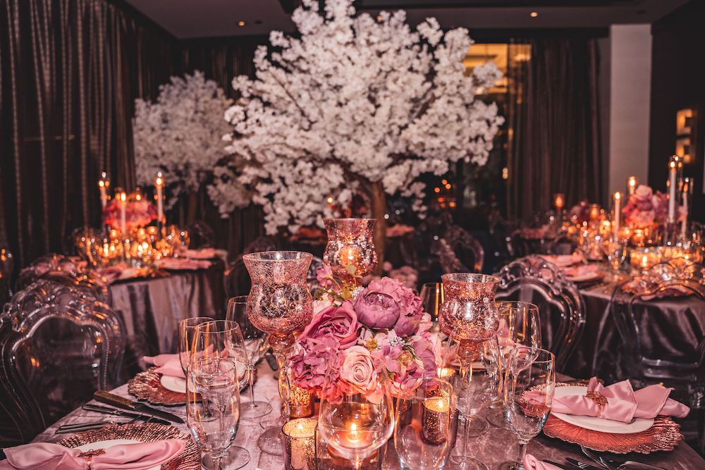 Pink and mauve wedding decor with dark silks and white cherry blossom trees, beautifully created by Mod Effect Events.