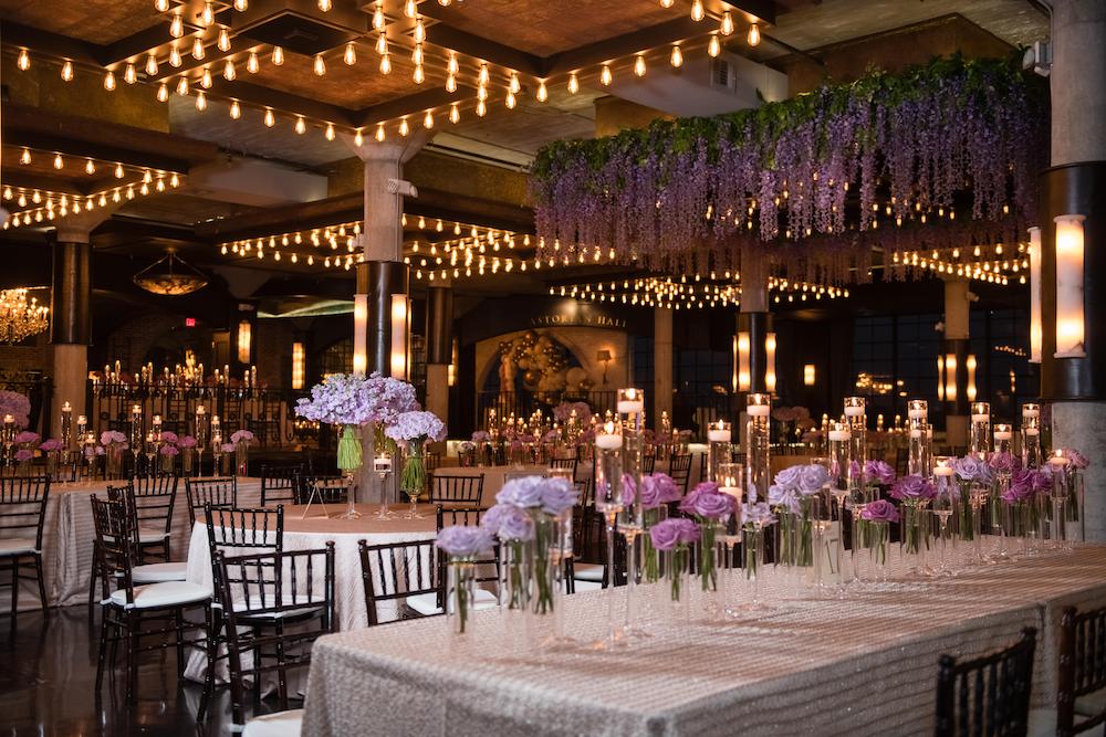Lavender and purple flowers stand out against the black and white industrial-chic decor at The Astorian.