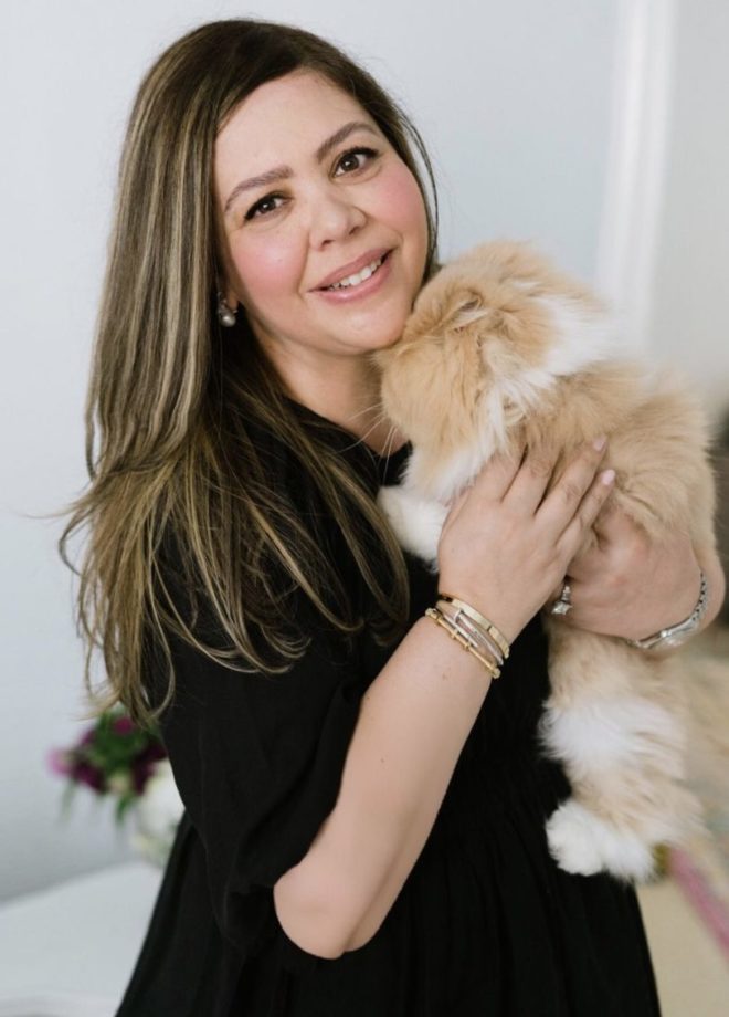 Bahara Jamea, Senior Designer at Plants N Petals, holding her Persian Cat. 