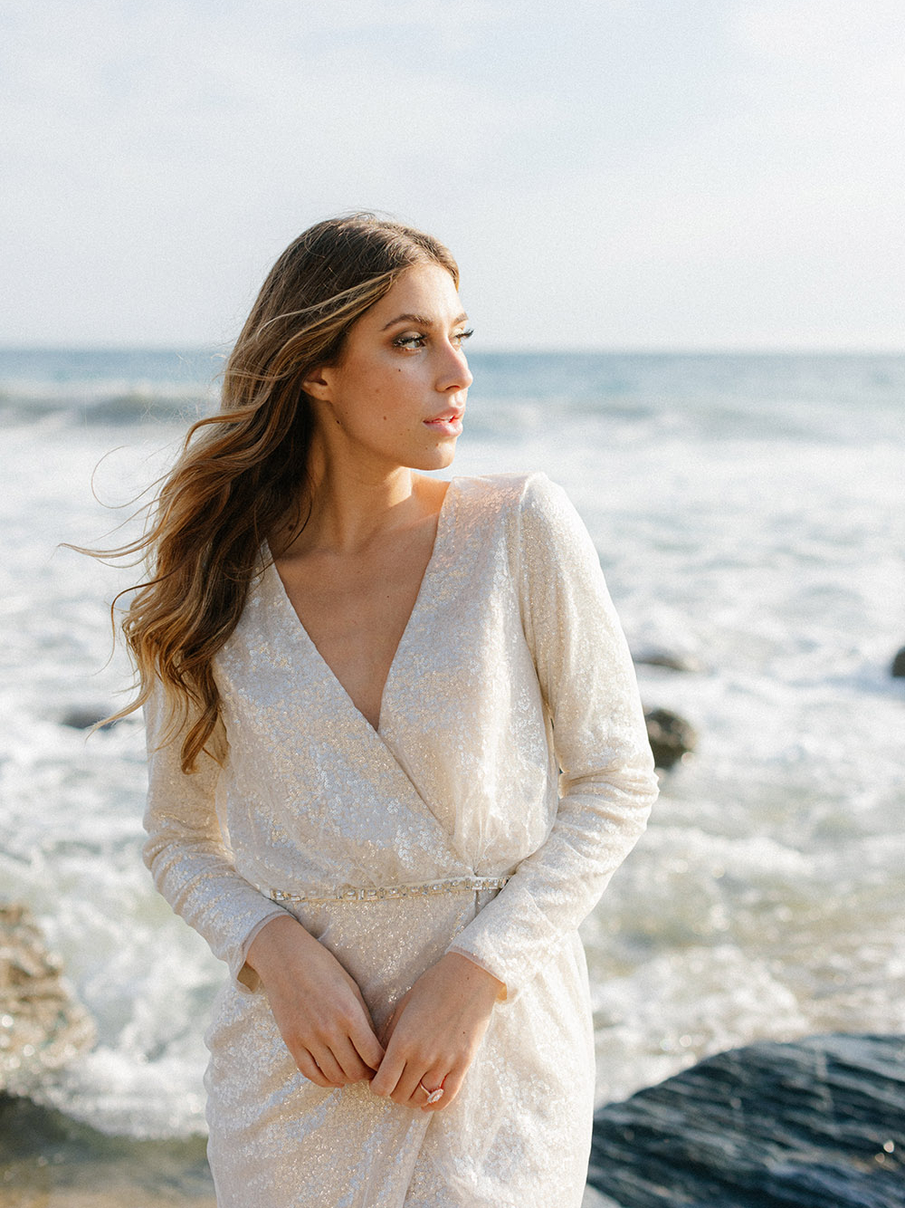 California sunshine illuminates the white sequins on the bride's Vera Wang mini dress.