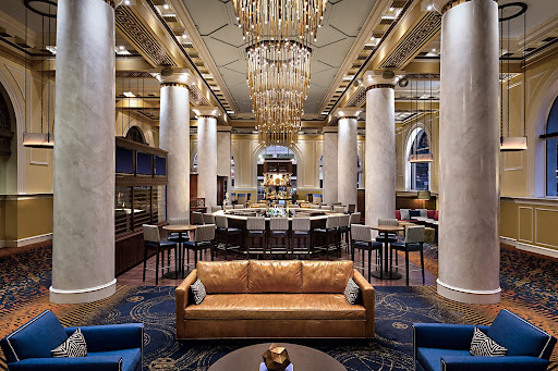 A column lobby with royal blue and gold interior details in downtown Houston Hotel Icon. 