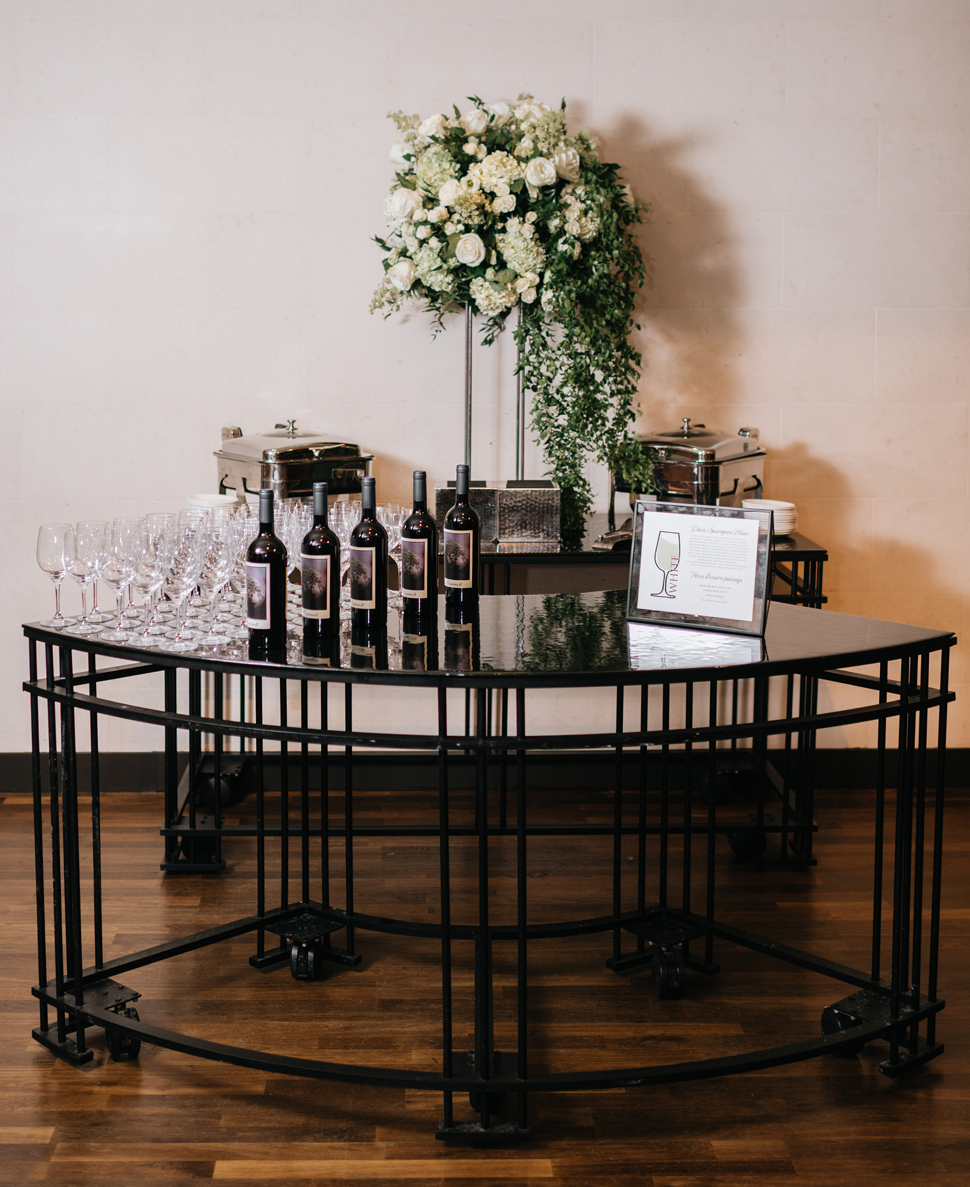 A wine tasting station at the cocktail hour of the wedding.