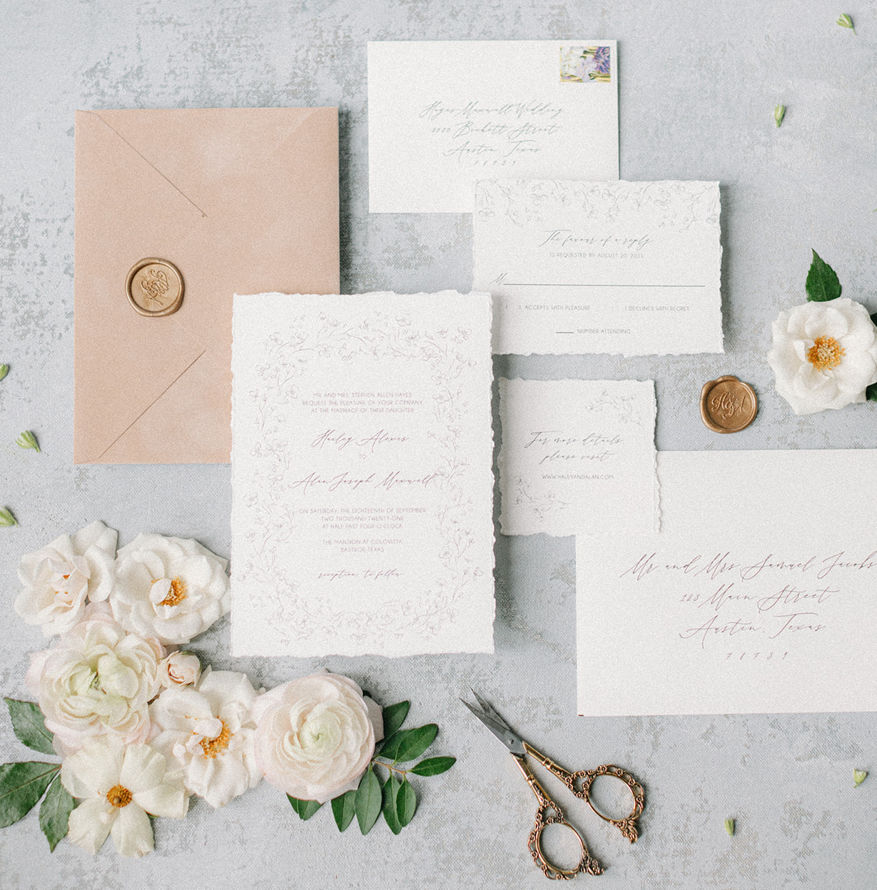 Flat lay of artfully designed southern invitations and stationary.