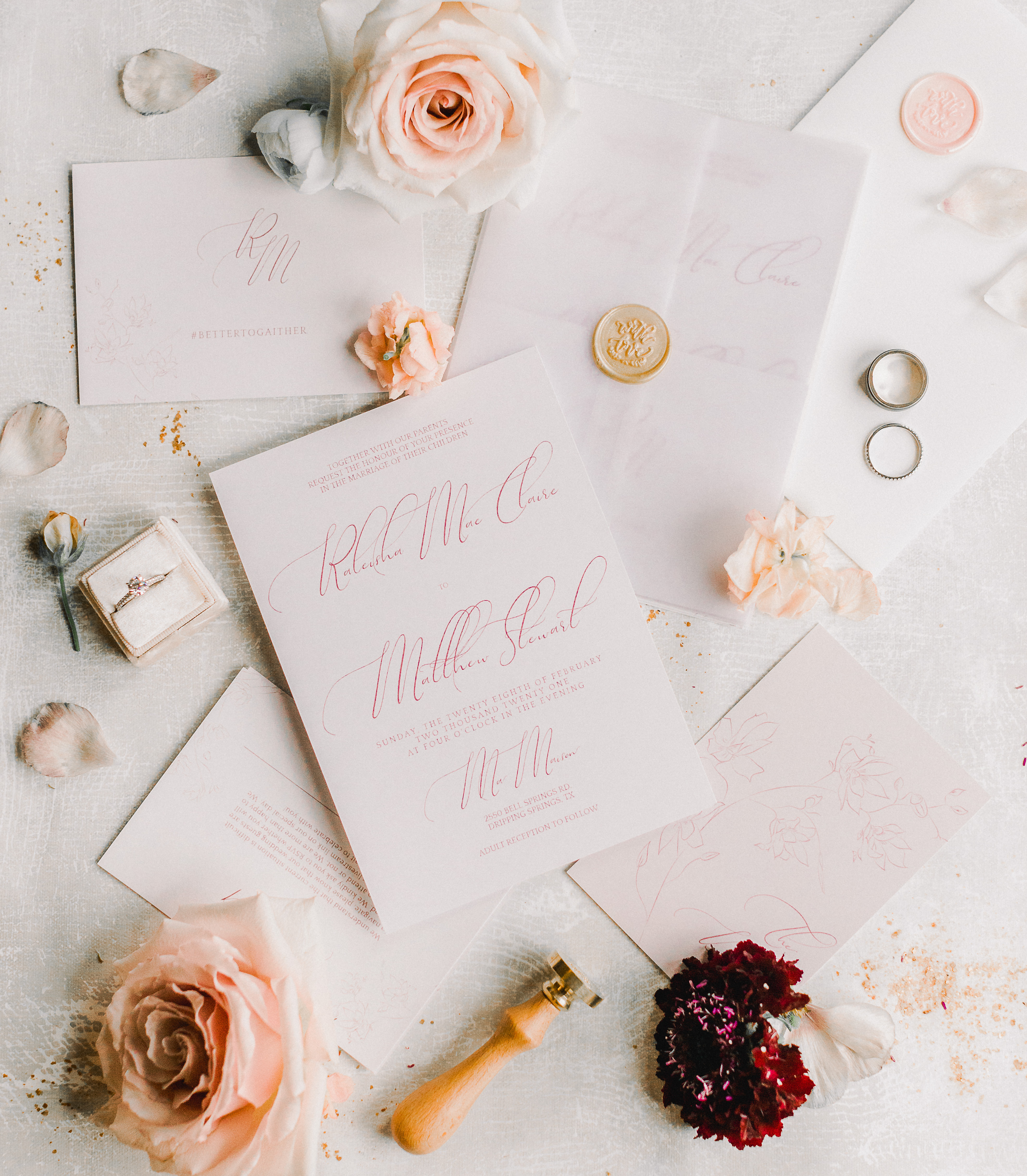 A romantic flat lay of the bride and groom's invitations for their sentimental wedding ceremony