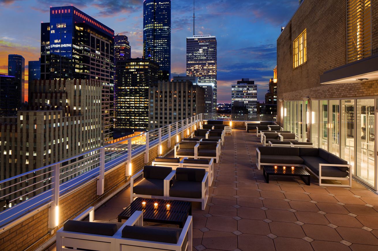 A sunset rooftop view of the Houston skyline at downtown hotel Le Meridien 