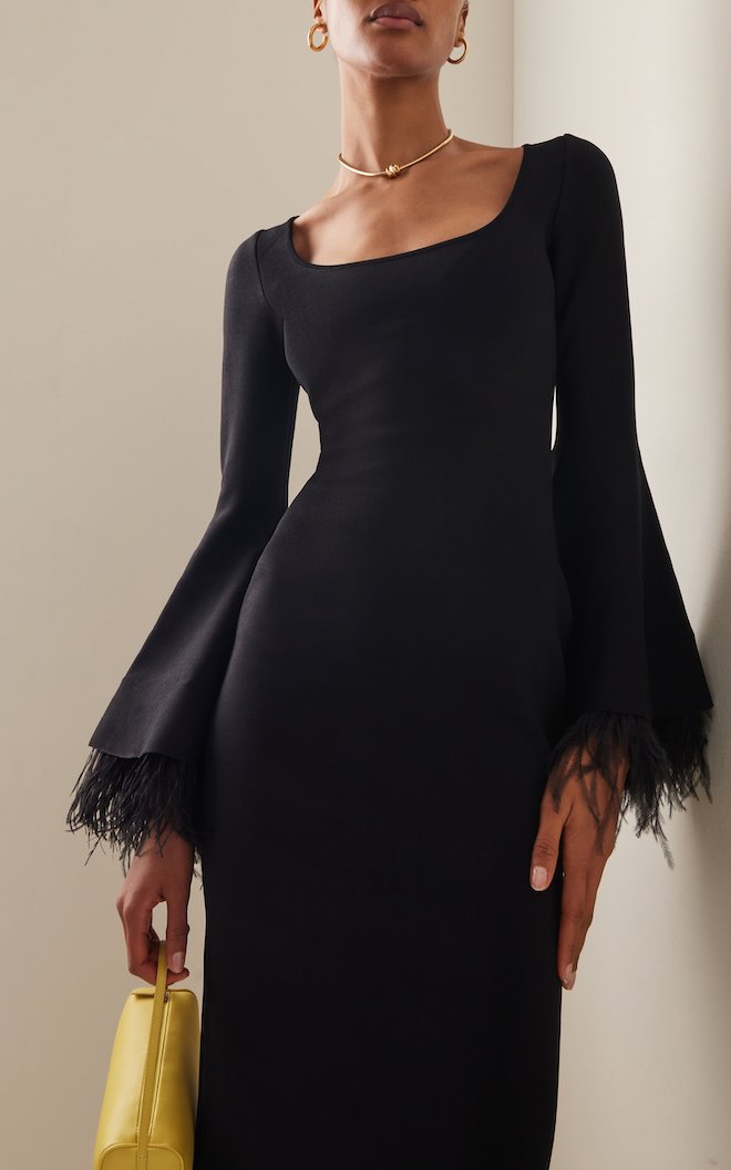 Black dress with feathered sleeves.