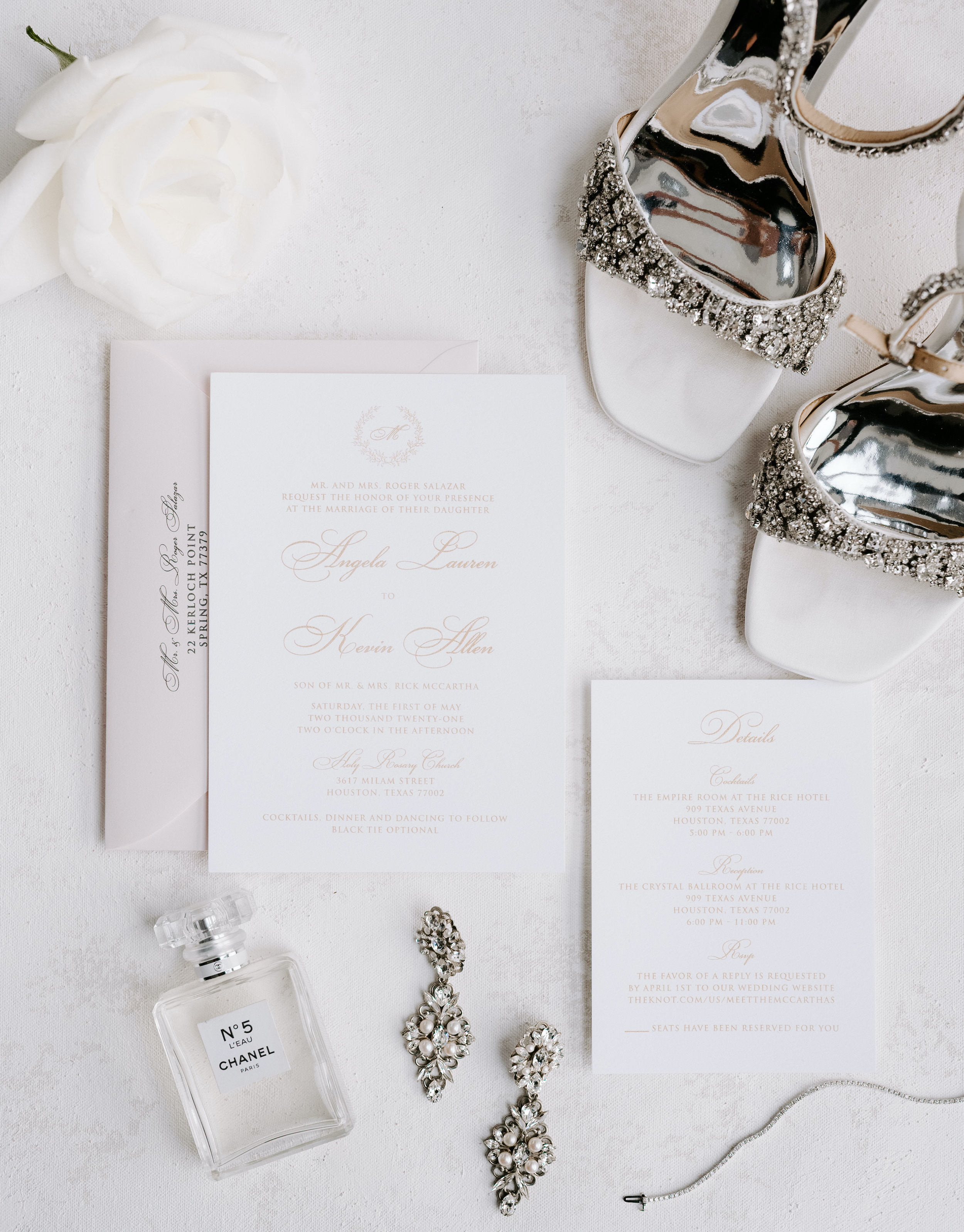 A flat lay with the wedding invitations for the elegant rainy wedding.