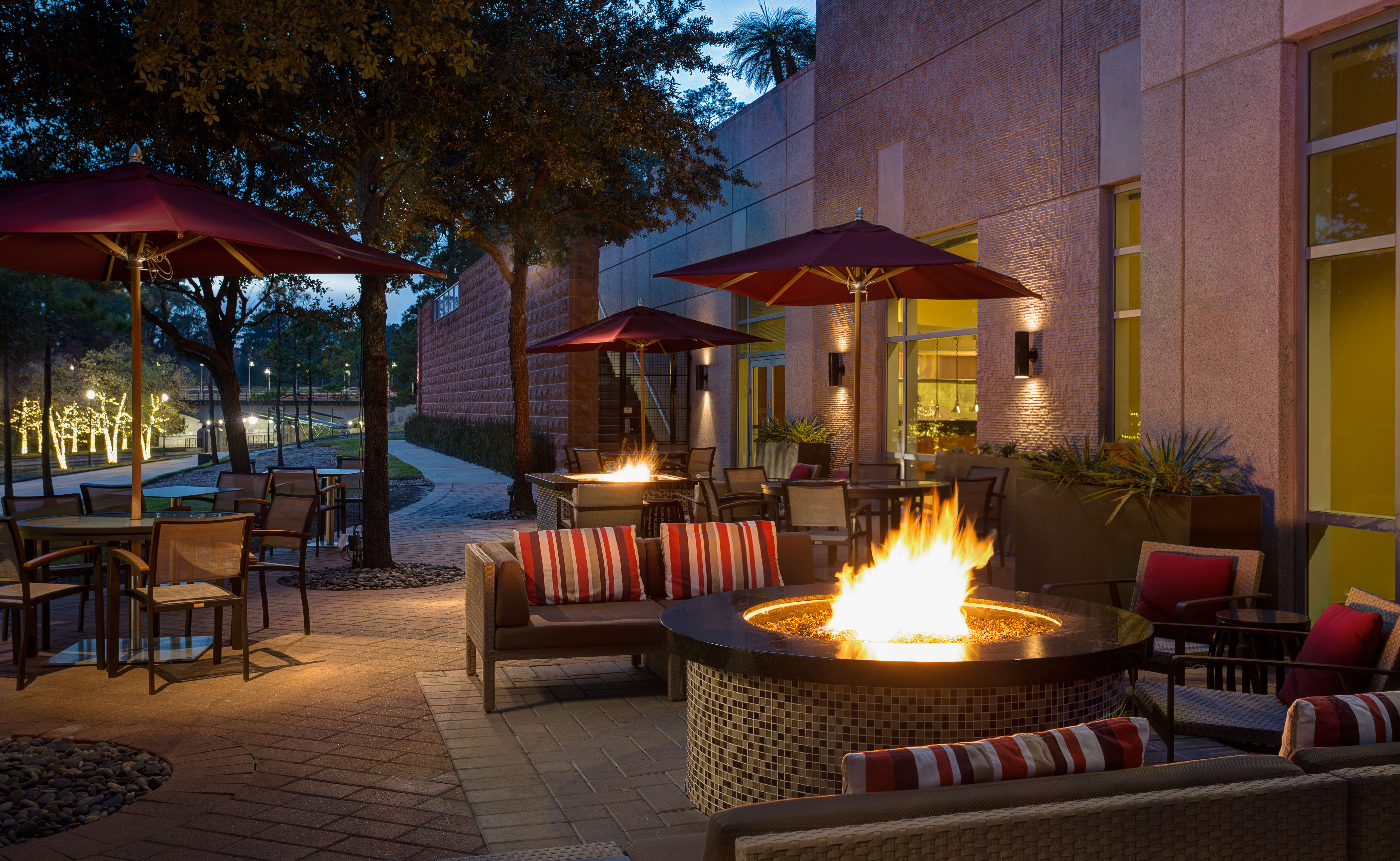Outdoor firepit at The Woodlands Waterway Marriott hotel, overlooking the trail.