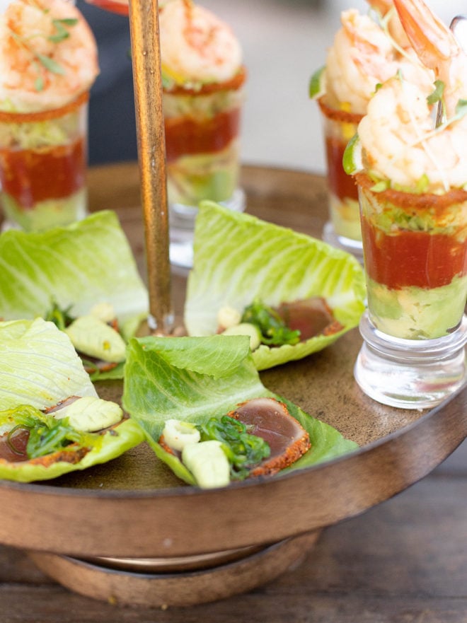 lettuce wraps with tuna and chives next to shrimp, lime and guacamole shooters by restaurant, Peggys on the Green, at a wedding styled shoot at wedding venue, The Kendall.