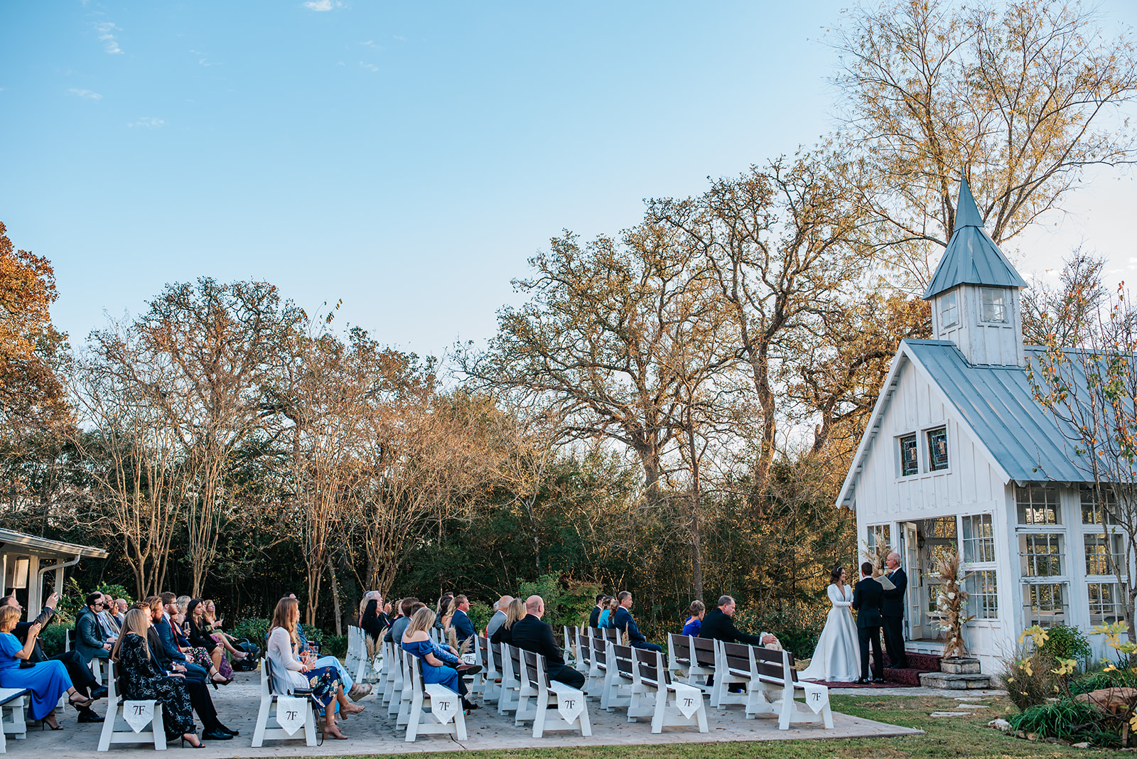 A side view of the alfresco intimate wedding ceremony in Aggieland at 7F Lodge.