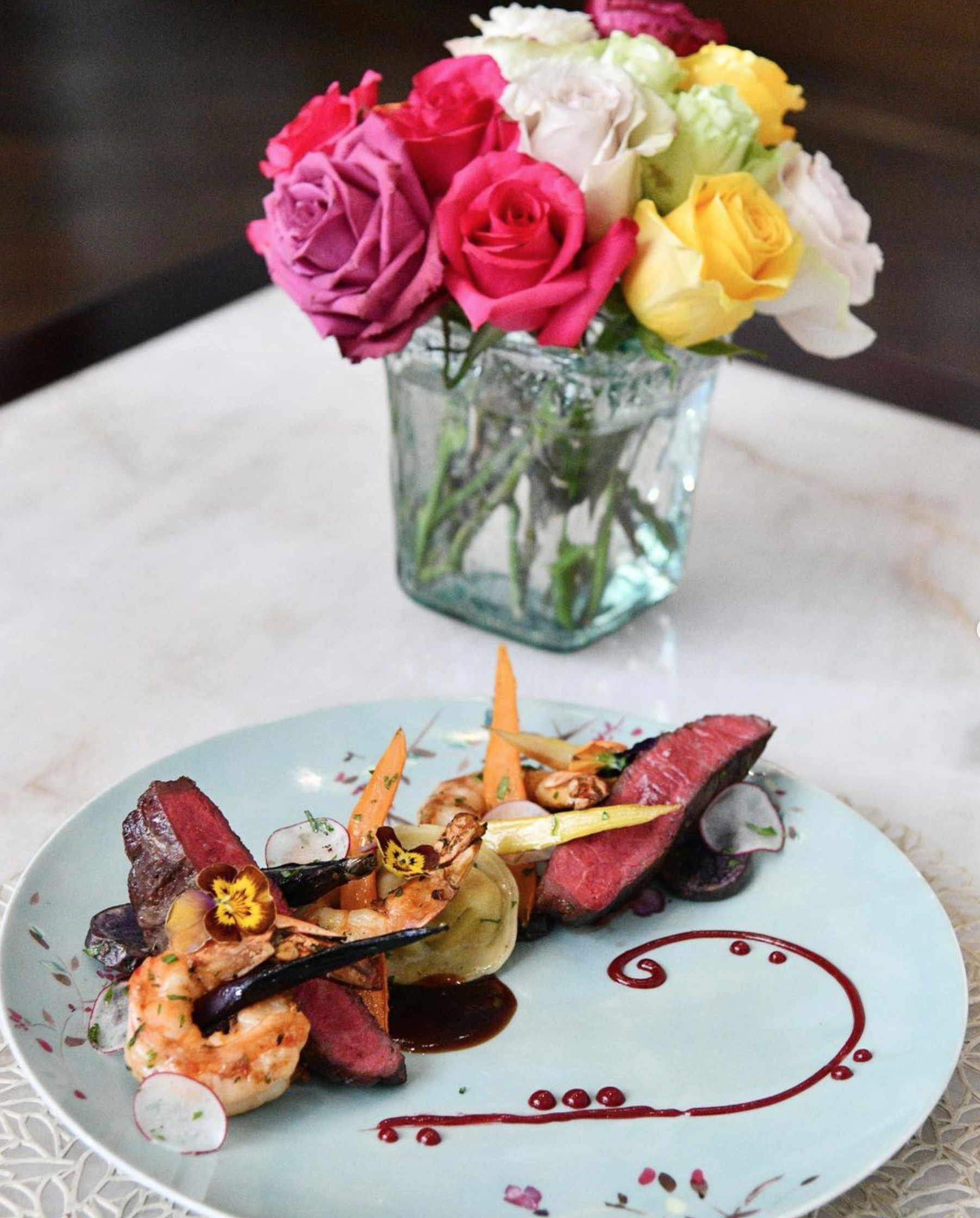 A dinner is served with a luxurious presentation for a Valentine's Day special at Bloom & Bee, a restaurant at The Post Oak Hotel at Uptown Houston in Texas.