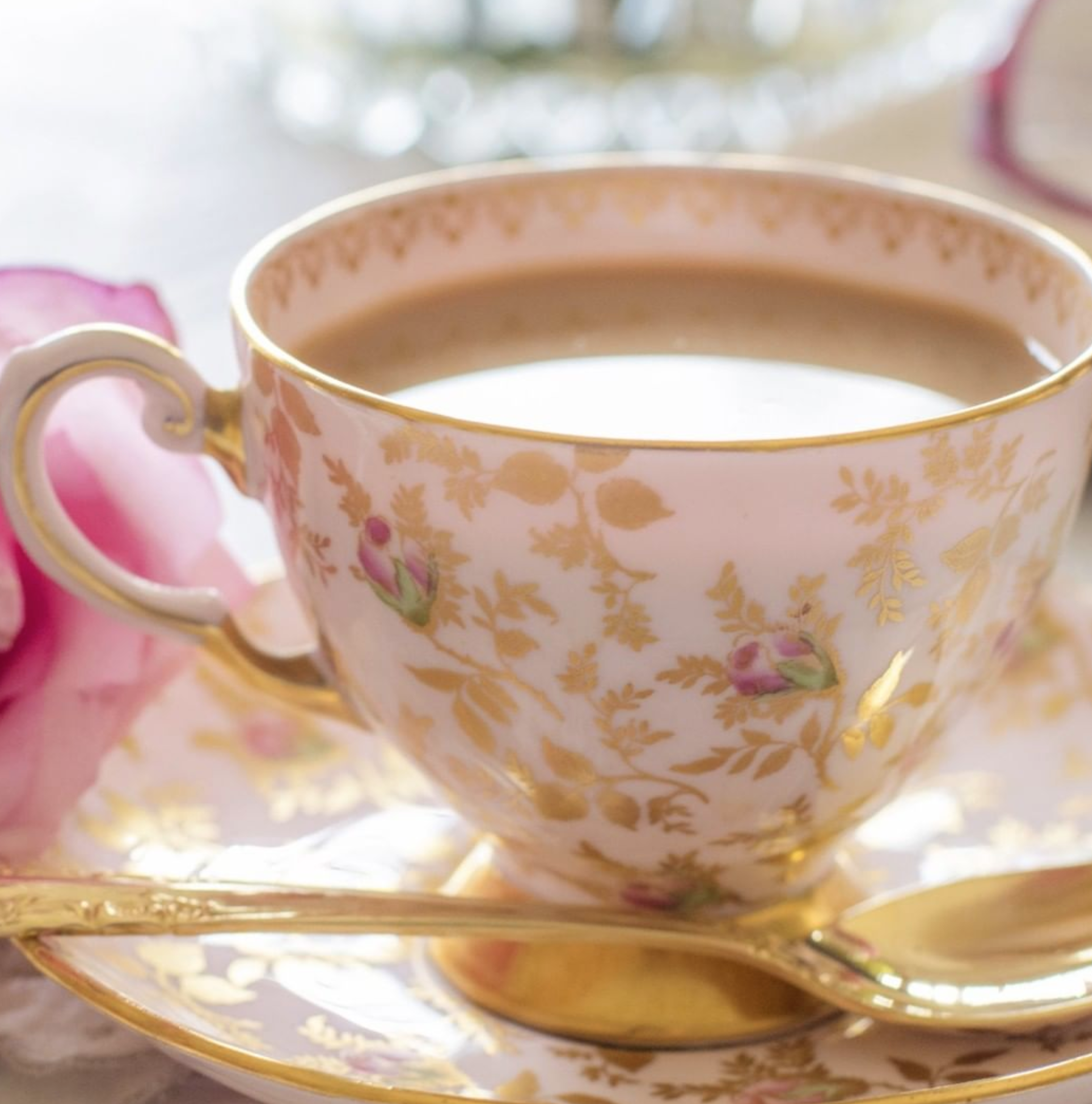 A gold, pink and white tea cup at Hotel Granduca for their Valentine's Day tea event happening in Houston, TX. 