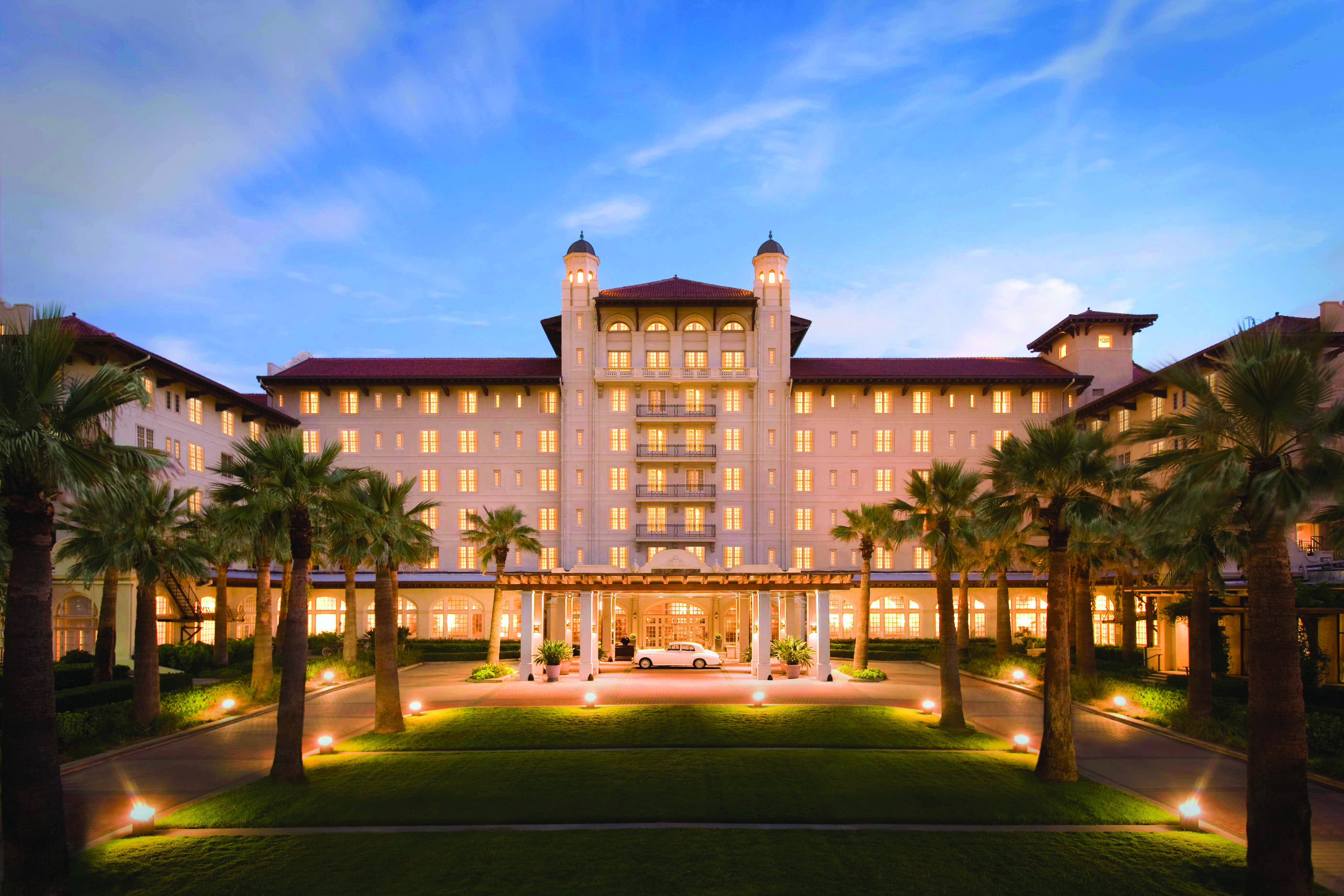 a front view of the Grand Galvez hotel in Galveston, TX on The Gulf of Mexico.