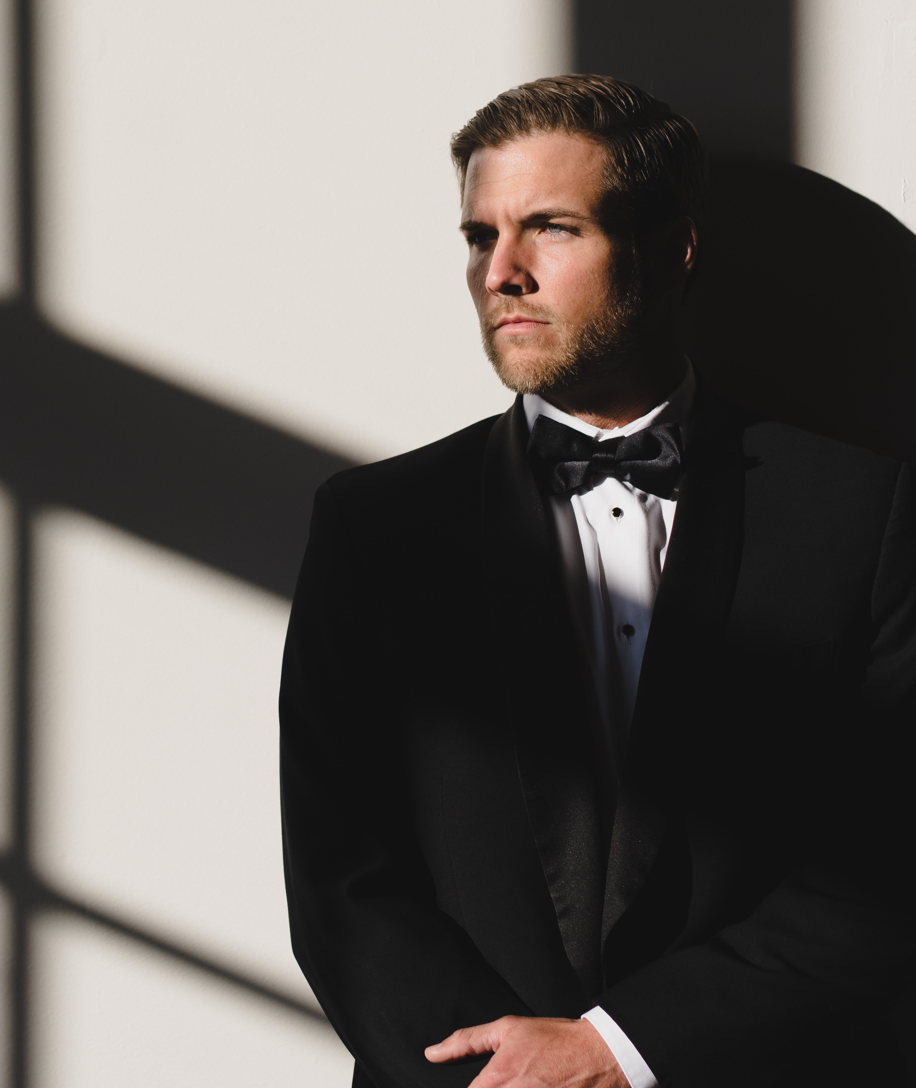 Bachelor Nation's Jordan Kimball looks out the window before his 1920's-inspired wedding at The Wynden in Houston, TX.