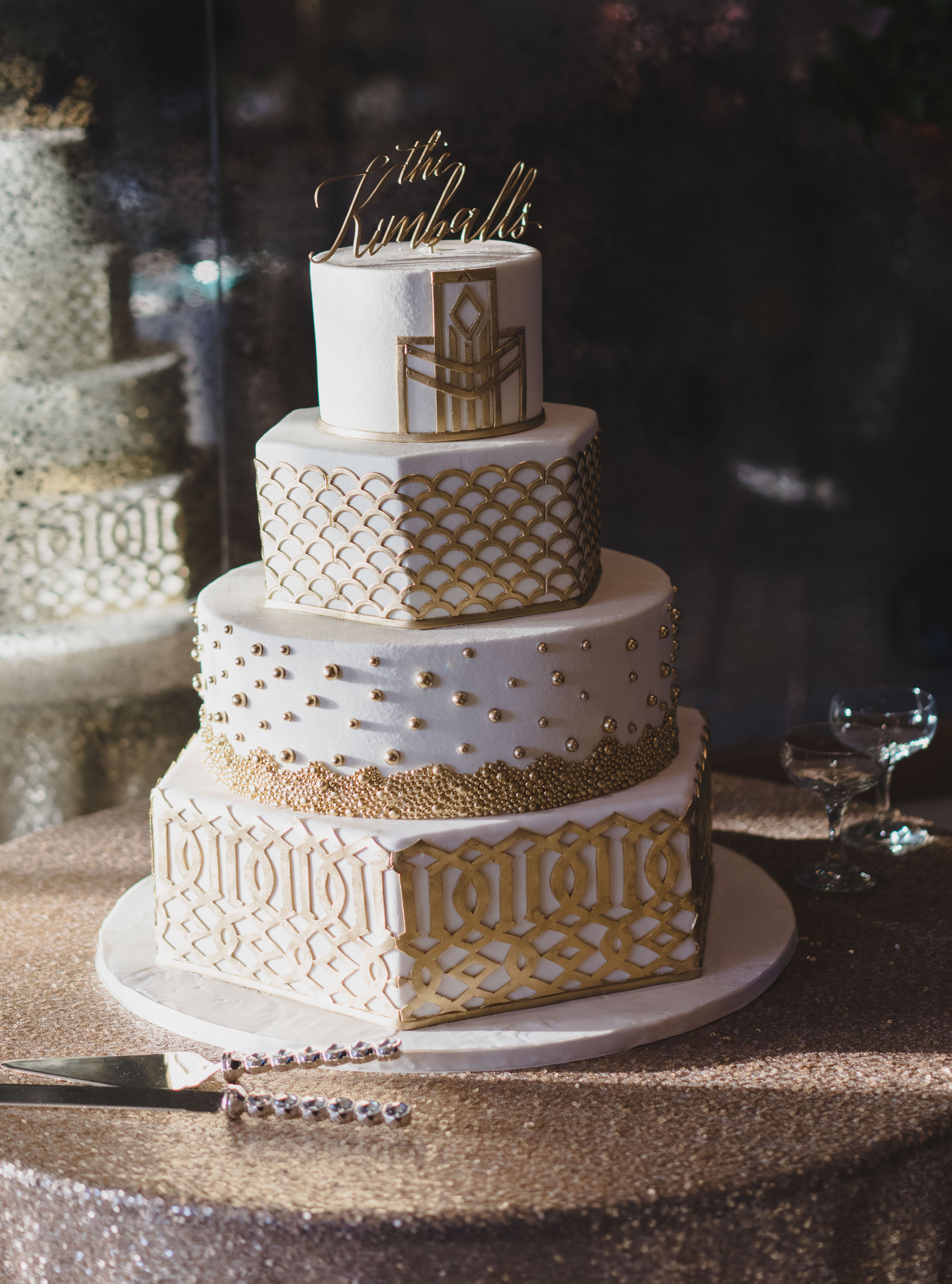 A 1920's-inspired 4-tier wedding cake designed by Susie's Cakes for a wedding in Houston.