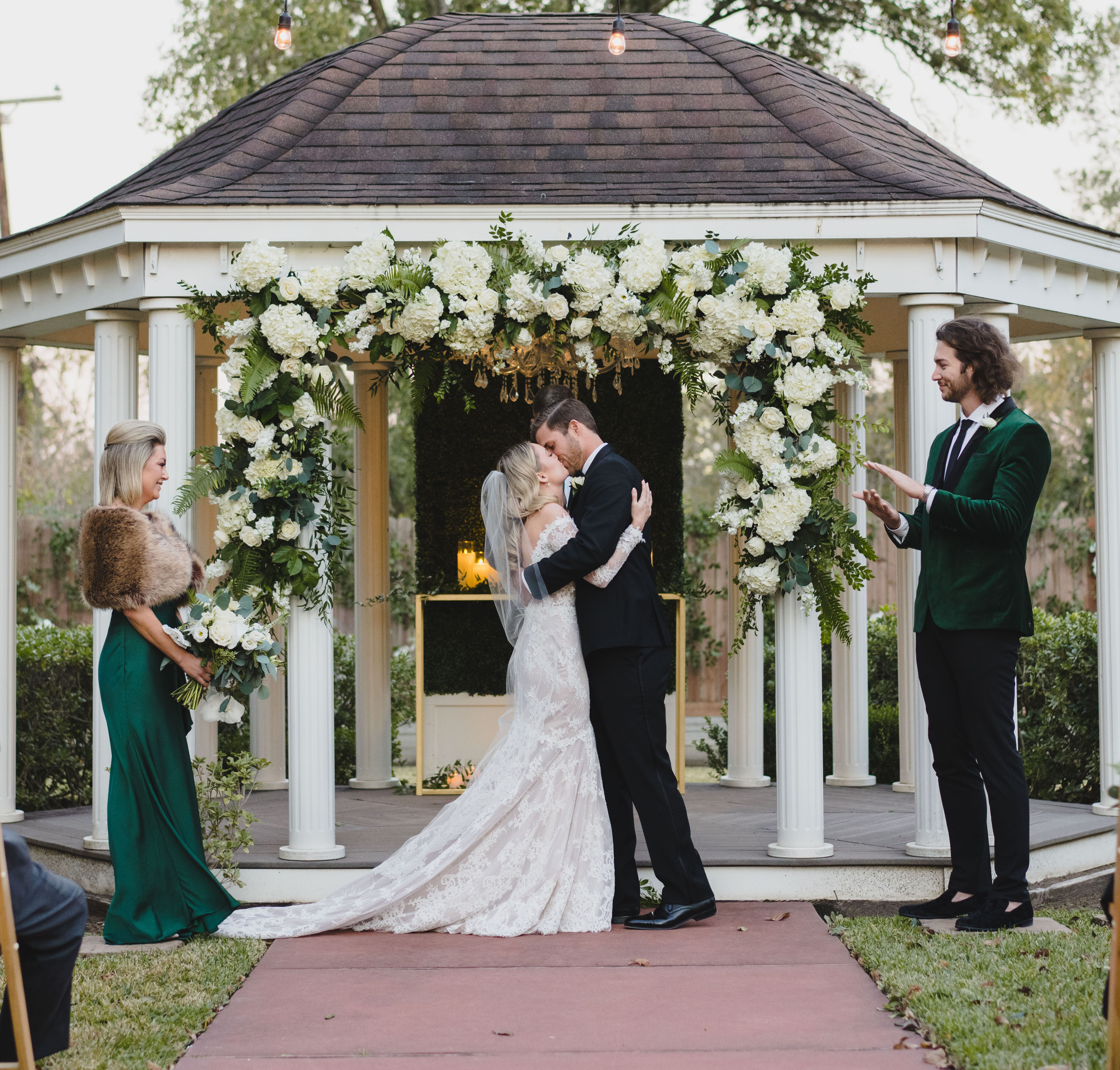 Jordan Kimball kisses his bride at their outdoor ceremony in Houston, TX at The Wynden.