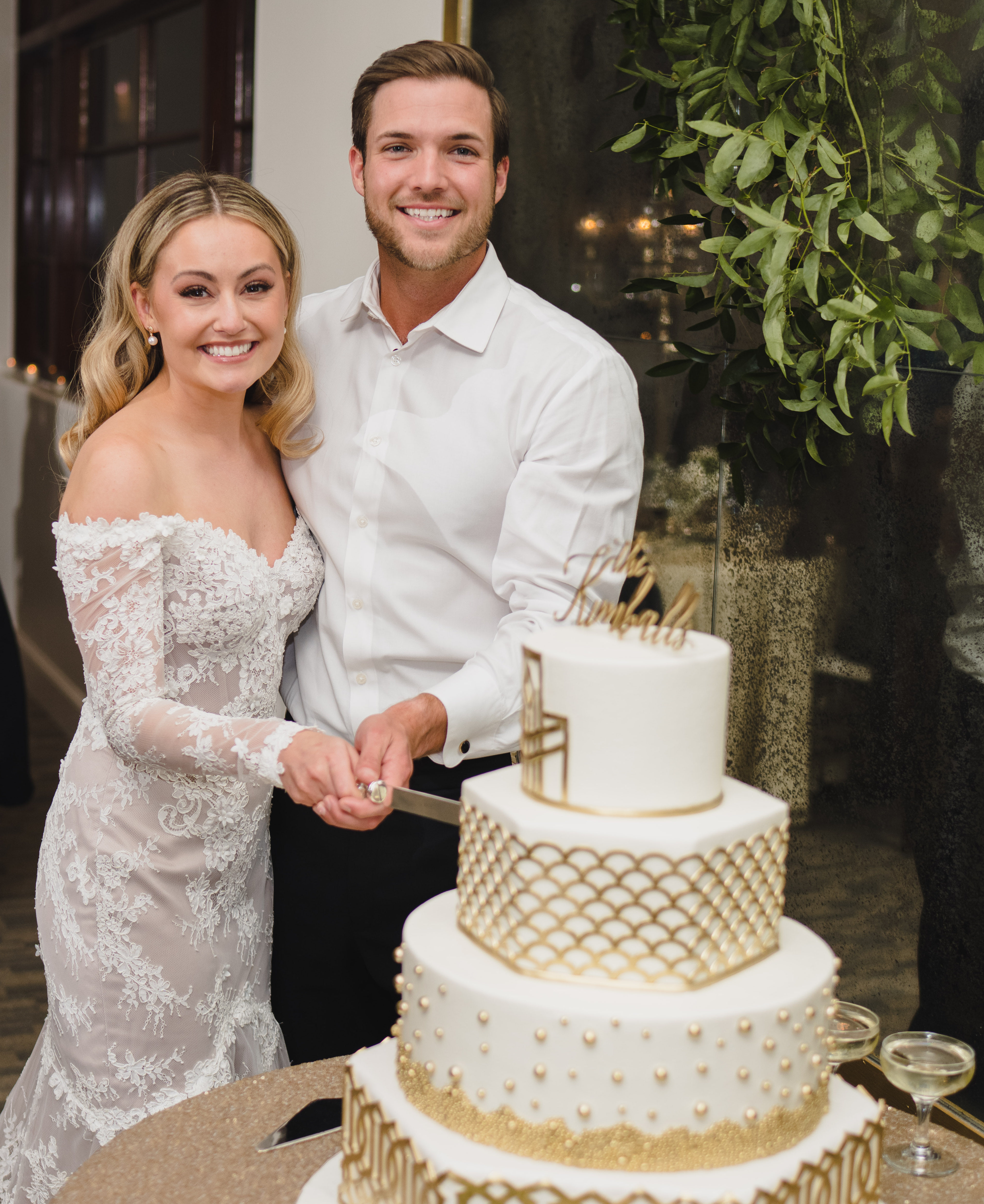 Jordan Kimball and Christina Creedon cut into their wedding cake at their reception in Houston, TX.
