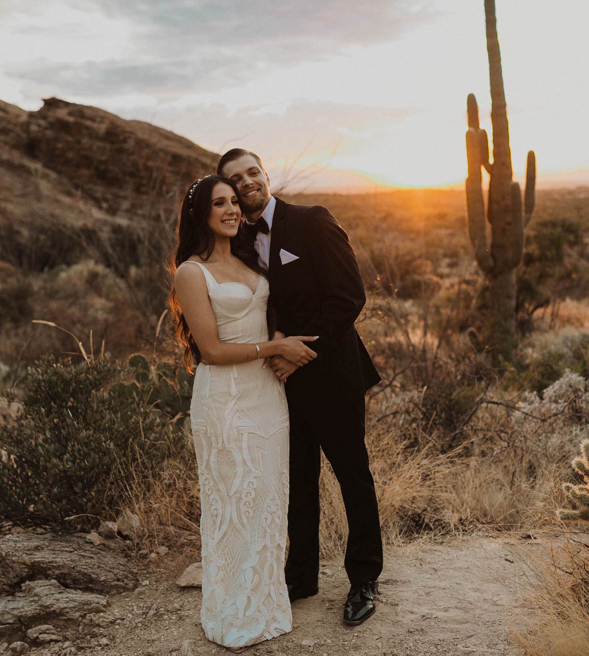 Riley from Caked Up With Riley smiles with her husband at their elopement in Arizona.