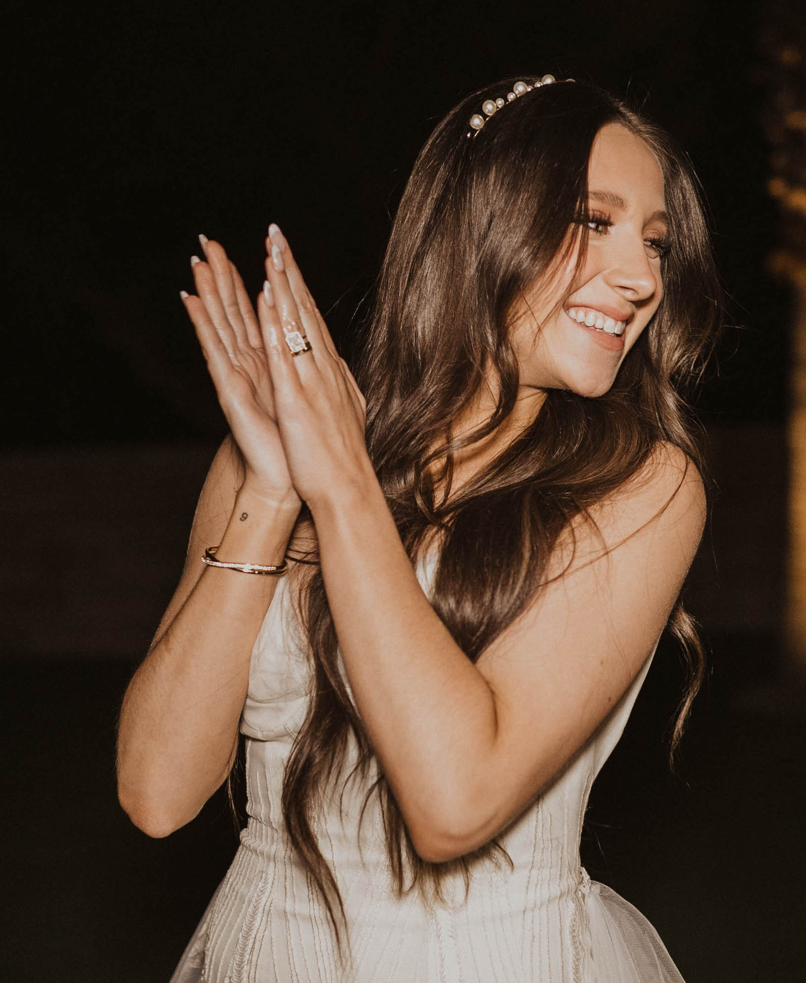 Riley, the owner of Caked Up With Riley, is smiling and dancing at her wedding reception in Arizona.