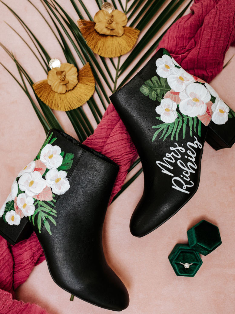 black boots with custom hand-painted white flowers and palms for a tropical havana styled shoot in Houston, TX.