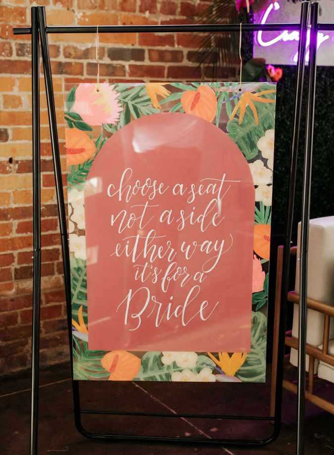 An LGBT wedding sign for a ceremony.