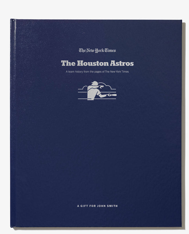 Blue book with a title which reads, "The New York Times...The Houston Astros....A Team History From the Pages of The New York Times"
