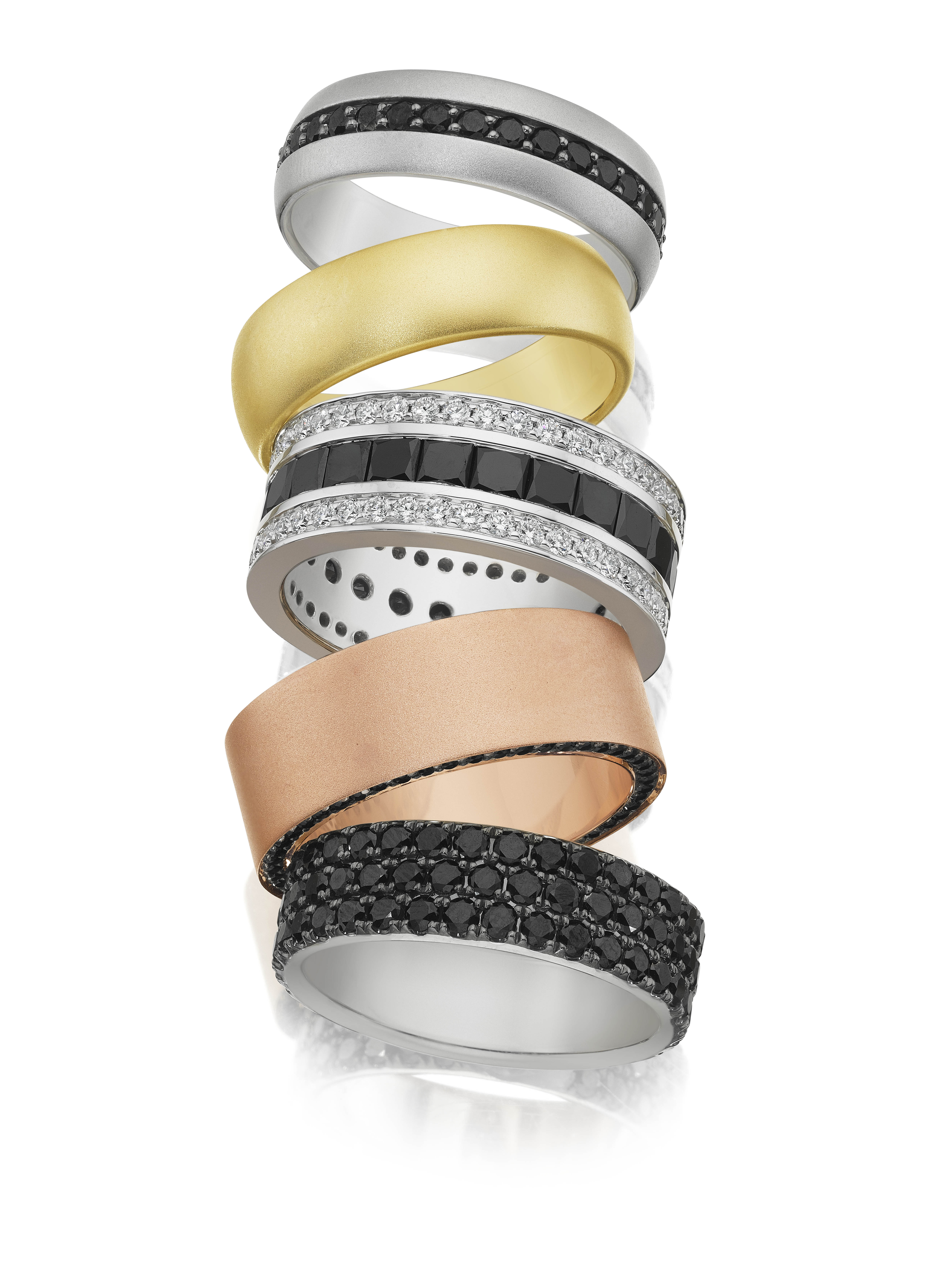 A variety of luxury wedding bands for the groom available at Zadok's, a jeweler in Houston.