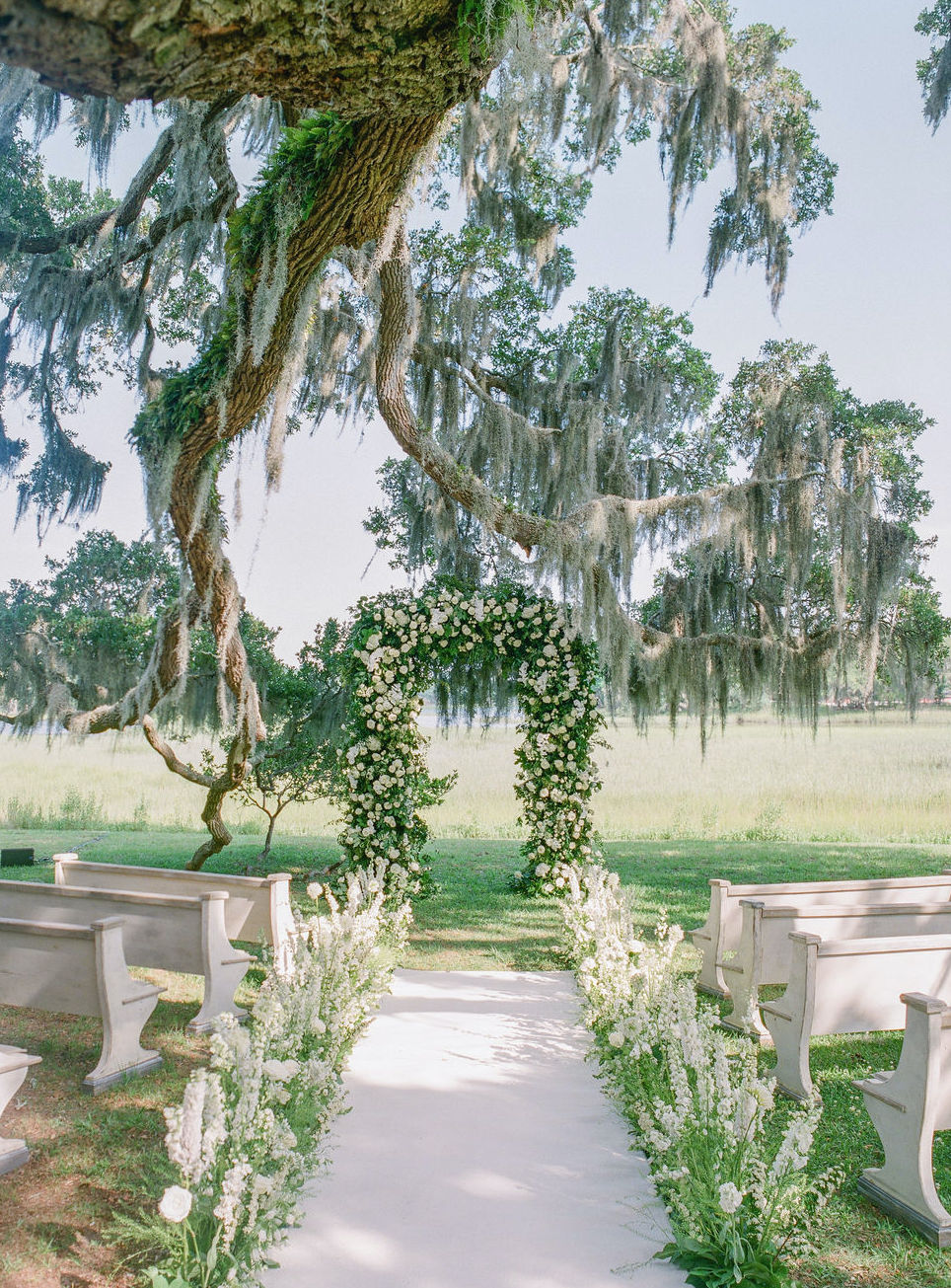 An alfresco ceremony in the Lowcountry in Charleston, SC. Planning and Designing by Tara Guérard Soirée